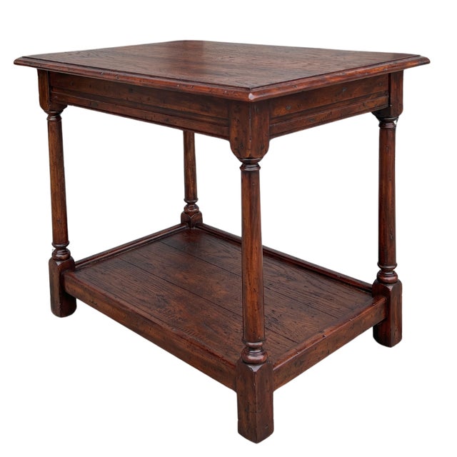 This table is showroom new and has never been used. Inspired by a 17th century Joynt stool, this Theodore Alexander table...