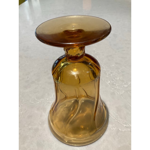 4 sets of 6 Glasses are Available Amber color 5 3/4” tall sand 3 3/4” wide at top 2” stem Heavy pressed glass Used, but...