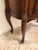 Description: 20th century two-drawer bedside commode nightstand with marble top Drawers open and close with ease, gilt...