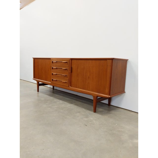 Authentic vintage Danish mid century modern teak credenza / sideboard / media console. By Bordum og Nielsen. Maker's label...