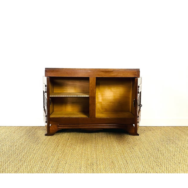 This charming low sideboard in solid oak is a fine example of rustic furniture from the first half of the 20th century,...