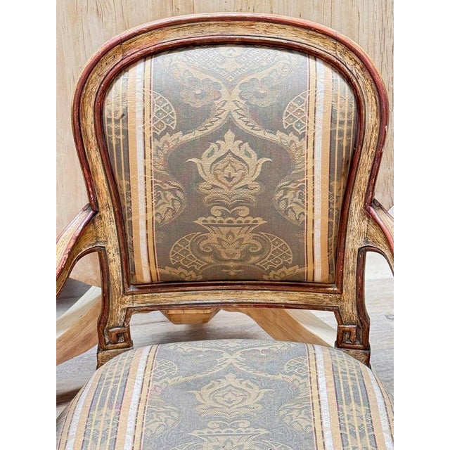 Fourteen Italian Louis XVI period paint-decorated laccatura dining chairs, 18th c., each having rounded back and seat, in...