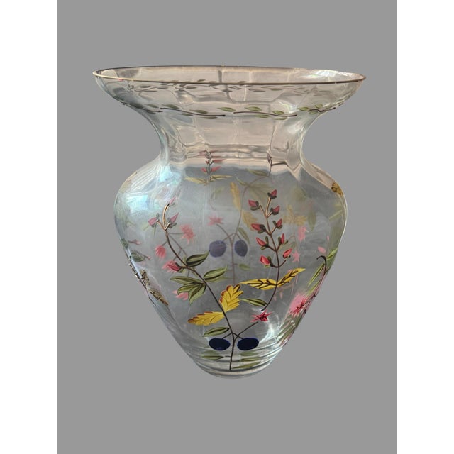 Beautiful antique clear art glass vase featuring elaborate hand-painted enamel floral and botanical decoration. The vase...
