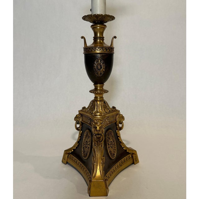 Fine quality gilt and patinated table or desk lamp. Elements include oval rosettes on the flat panels of a three sided...
