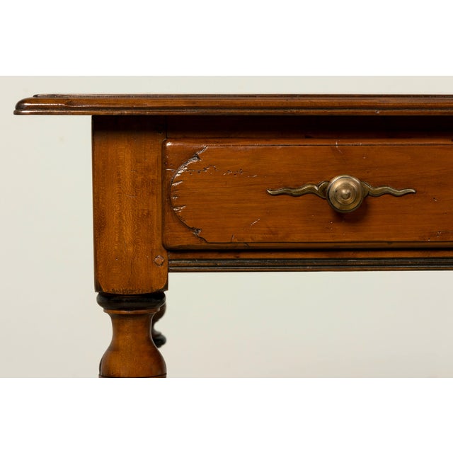 A late 19th-century French Louis XIV style walnut writing table or desk, sourced in Provence, France. The table features a...