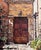 A richly textured original oil painting depicting a sun-washed Mediterranean-style courtyard centered by a pair of...
