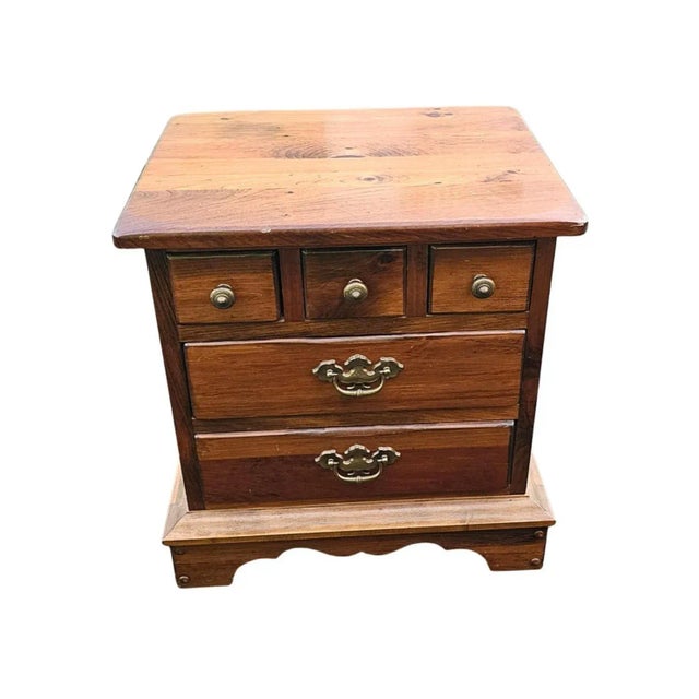 A Mid-20th Century Solid Pine Five-Drawer Bed Side Table Nighstand finished on all sides, Features 3 small top drawers and...