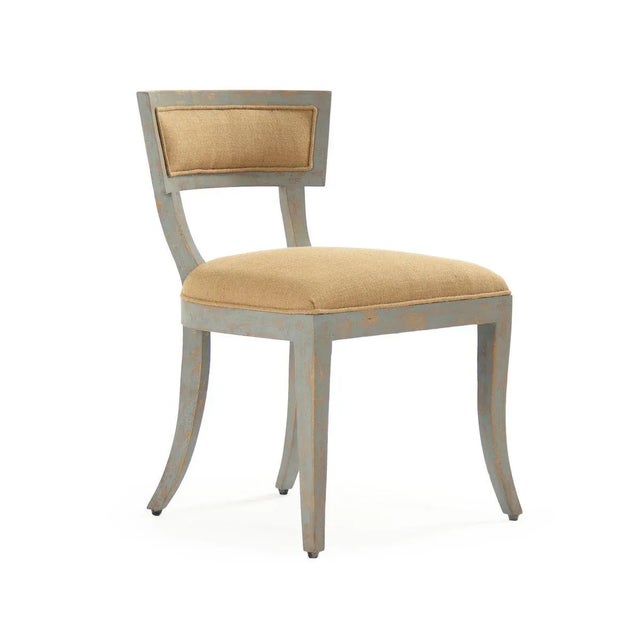 Side chair with burlap upholstery, four curved legs, padded back, and foam filling.
