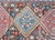 A remarkable early 20th century Persian Kazak rug with three large diamond medallions, each woven with stylized flowers,...