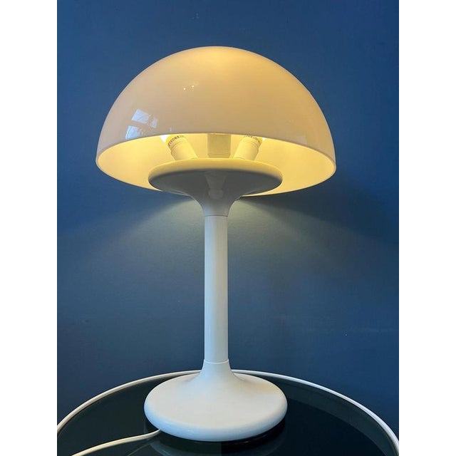 White Dijkstra mushroom acrylic glass table lamp. The white acrylic glass shade produces a nice and warm light. The lamp...