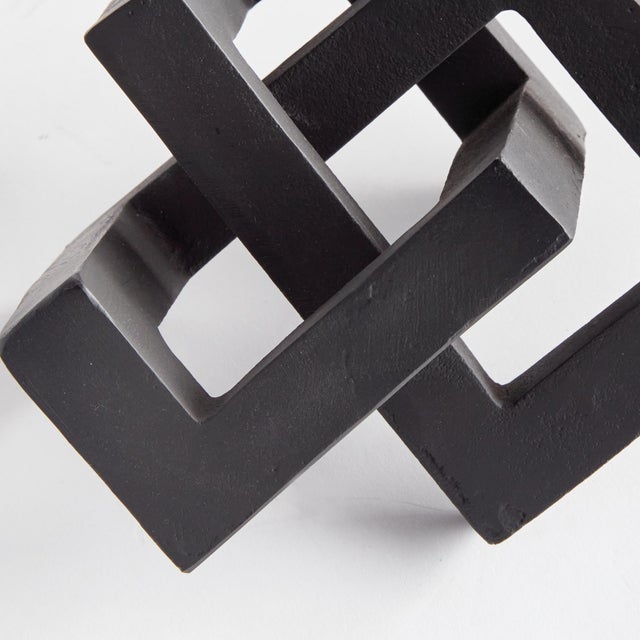 A geometric marvel, this linear sculpture is a strong, substantial accent in matte black. Place atop a stack of books or...