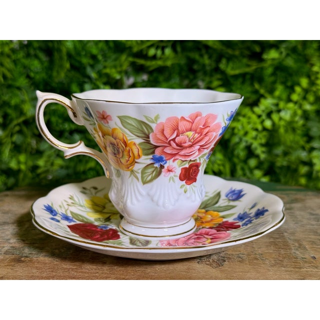 Indulge in a spot of tea with this exquisite vintage Royal Albert "Somerset" teacup and saucer set, a charming piece from...