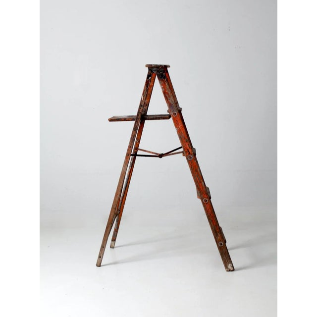 An early 20th century wooden painter’s ladder with a classic A-frame form and a beautifully timeworn presence. The surface...