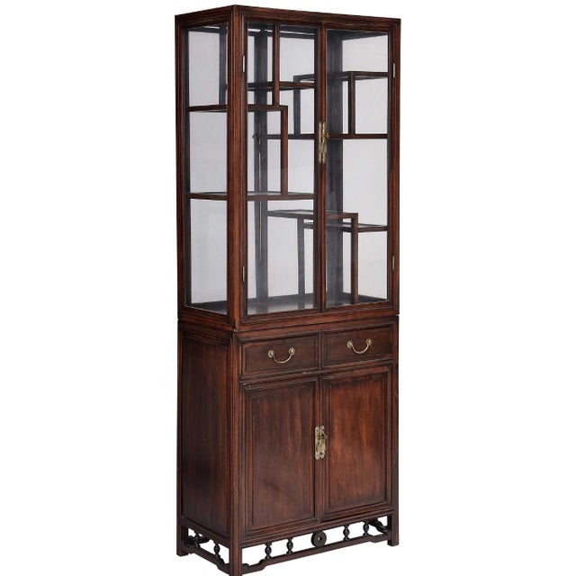 probably 1930s, possibly hungmu or huanghuali, each well-crafted with figured hardwoods, two drawers over two paneled...