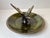 Circular bronze bowl with applied green verdigris patina (cold paint). Sculptural center figurine in shape of an eagle. It...
