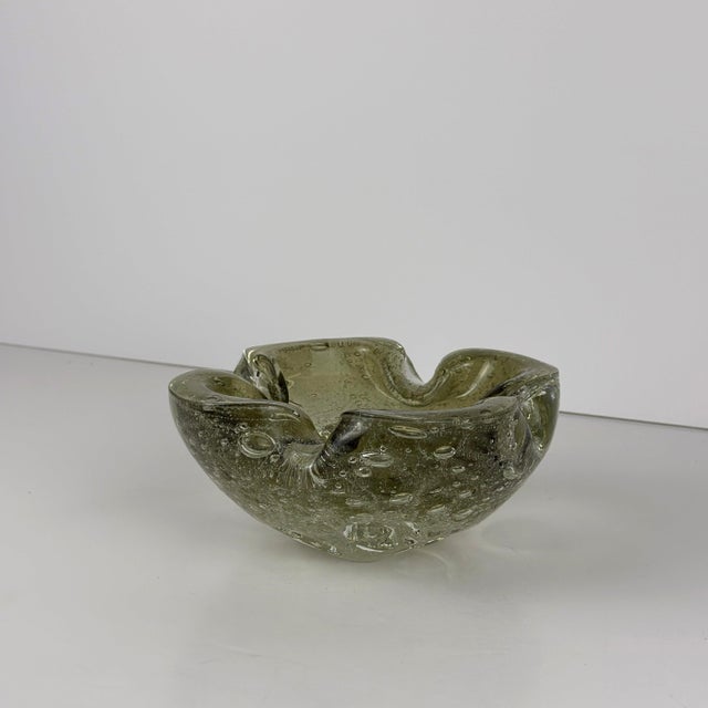 A mid-century Galliano Ferro pulegoso Murano glass bowl, created in Murano, Italy, during the 1960s, in subtly olive-green...