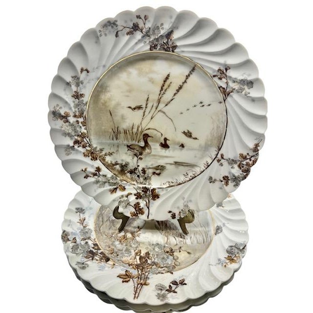 Exceptional collection of four antique Haviland & Co. Limoges porcelain decorative plates, dating to approximately 1887....