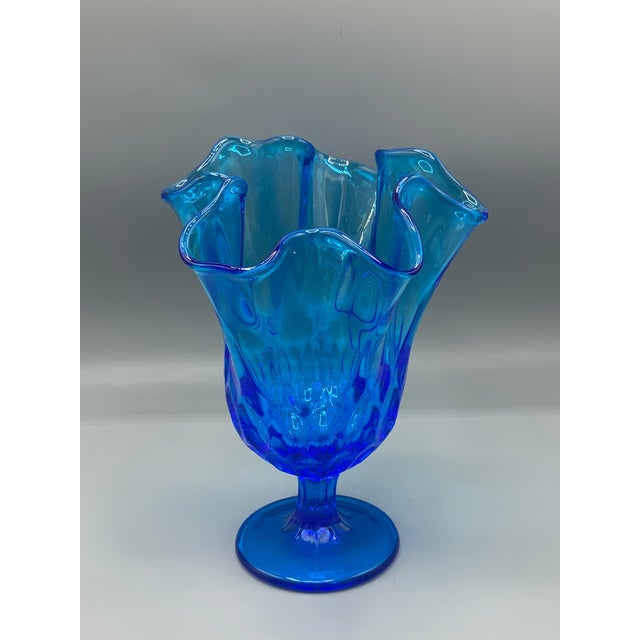 Fenton Colonial Blue Thumbprint Thousand Eye Footed Handkerchief Vase No chips or cracks. Measures roughly 8.5" tall by 6"...