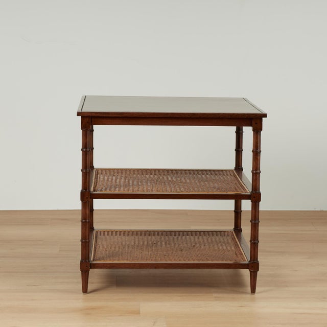Standout pair of vintage stands crafted in mahogany with pegged construction with two caned lower tiers on classic turned...