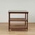 Standout pair of vintage stands crafted in mahogany with pegged construction with two caned lower tiers on classic turned...