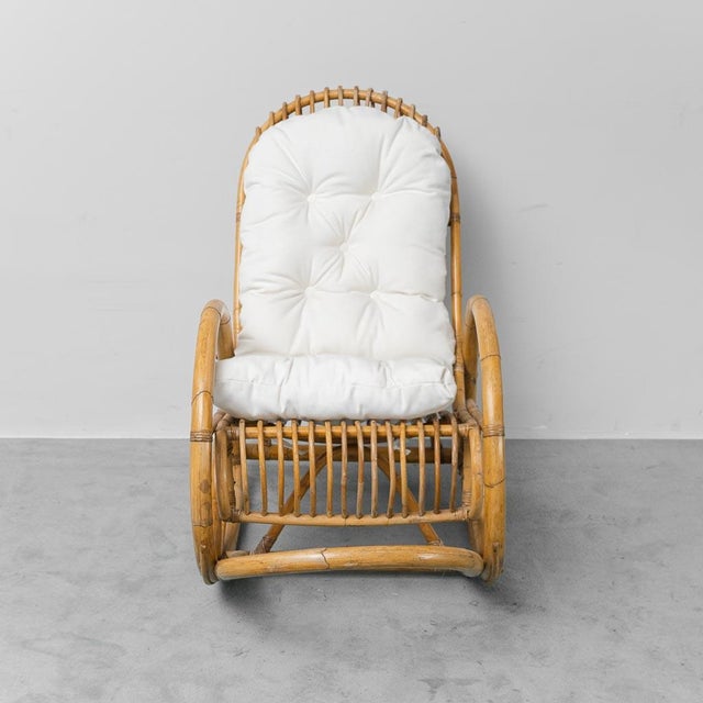 Rocking chair. Designed by Dirk Van Sliedregt for Rohe Noordwolde. Bamboo frame and fabric cushion. 1970s design. Signs of...