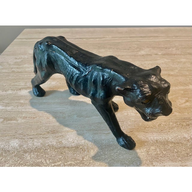 Leather black panther sculpture with a nice patina. Great decorative piece for a shelf or living room.