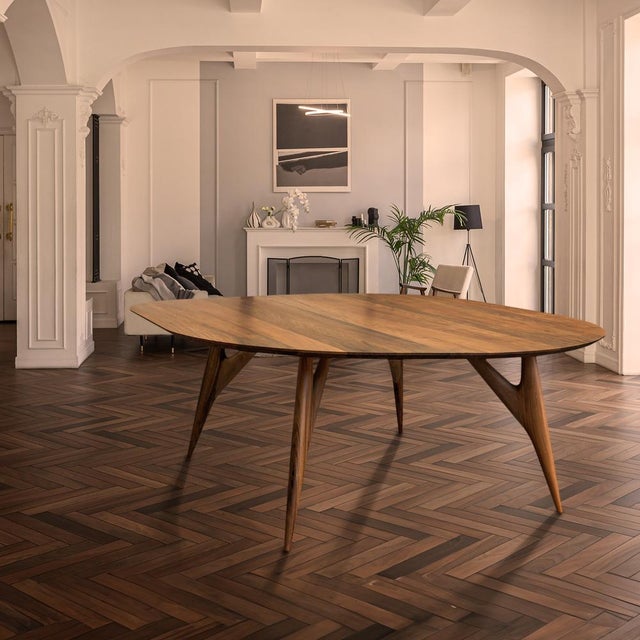 The KAI Small Table in solid Italian walnut is a refined expression of sculptural minimalism, where material purity meets...