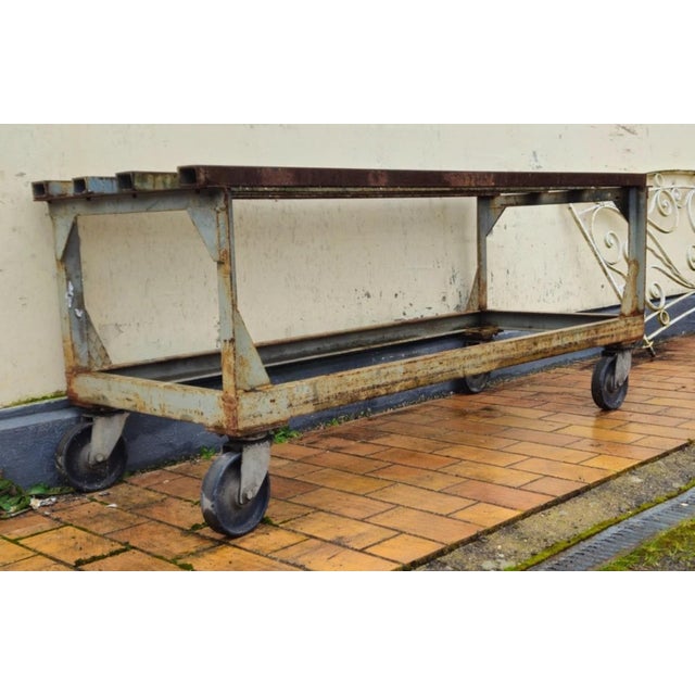 Industrial Metal Workbench/Table on Casters, Mid-20th Century Large industrial metal workbench, originally designed for...