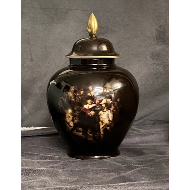 A striking mid-century porcelain urn by Goebel Porzellan, Germany, finished in high-gloss black with gilt banding and...