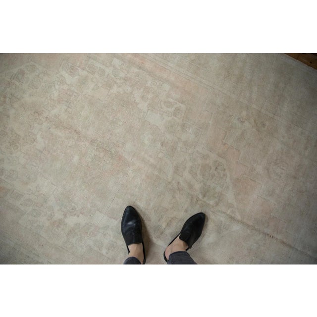 :: Oversized center medallion with interior minor blossoms and buds atop a narrow main field with corner spandrel overlays...