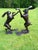 A wonderfully playful and impressive pair of oversized boxing hares, cast in bronze and finished with a rich cherry-brown...