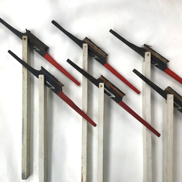 Circa 1940s set of six red, white and blue wood ice fishing tip ups found in Maine. Tip ups have wear from use, scratches,...