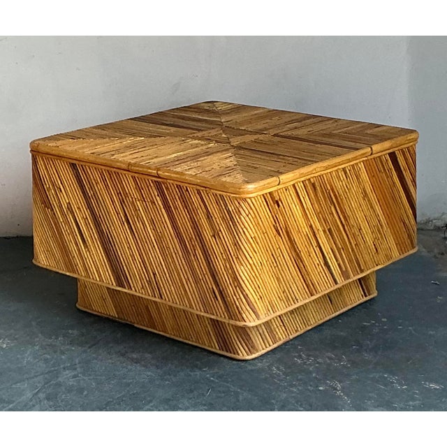 This captivating vintage coffee table exemplifies exceptional craftsmanship in natural materials, featuring a robust,...
