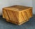 This captivating vintage coffee table exemplifies exceptional craftsmanship in natural materials, featuring a robust,...