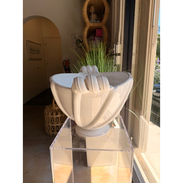 Bring timeless elegance to your décor with this decorative ceramic bowl, featuring a clean white finish and a sculptural...