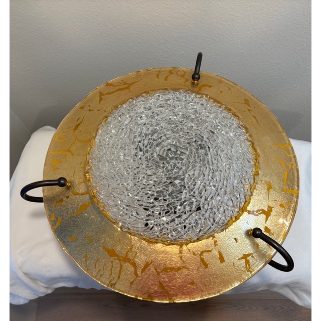 Exquisite Italian lace glass design in the center with gold leaf halo and a bronze finish framework. Beautiful chandelier...