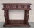 20th century console carved table Renaissance made of solid walnut wood It features carvings of mythological animals and...