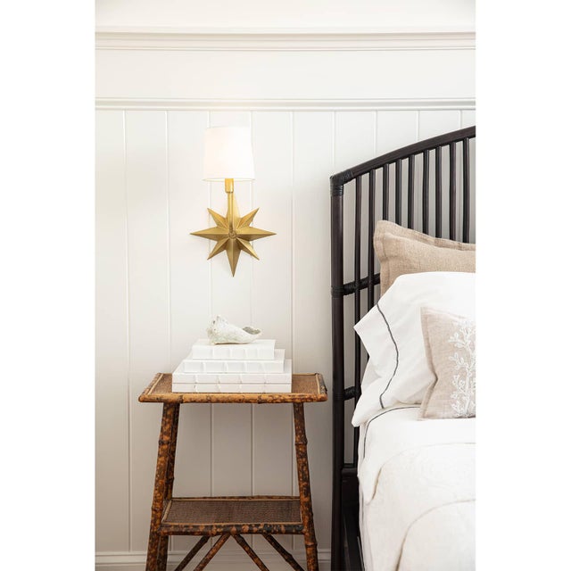 The Etoile Sconce exudes a classic coastal aesthetic with its attractive nautical star motif. Each raised edge of the star...