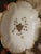 Vintage elegant porcelain pedestal soap dish featuring a scalloped rim, hand‑applied gold trim, and a central gold floral...