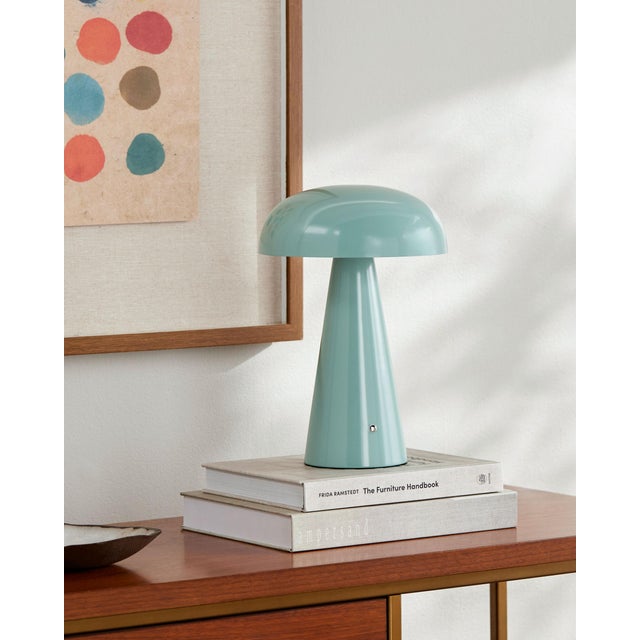 Illuminate your space with the chic and portable Umbra accent table lamp, a beacon of minimalist modern style. Standing at...