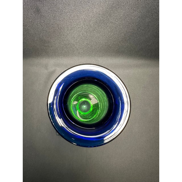 Vintage mid-century modern glass art vase.This beautify designed vase starts at the fluted lip with a vivid transparent...