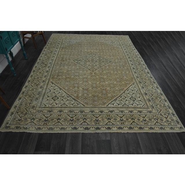 Vintage Persian Hand-Knotted rug is a semi- vintage oversize area rug.'70s Eastern region of Middle East's unique rug is...