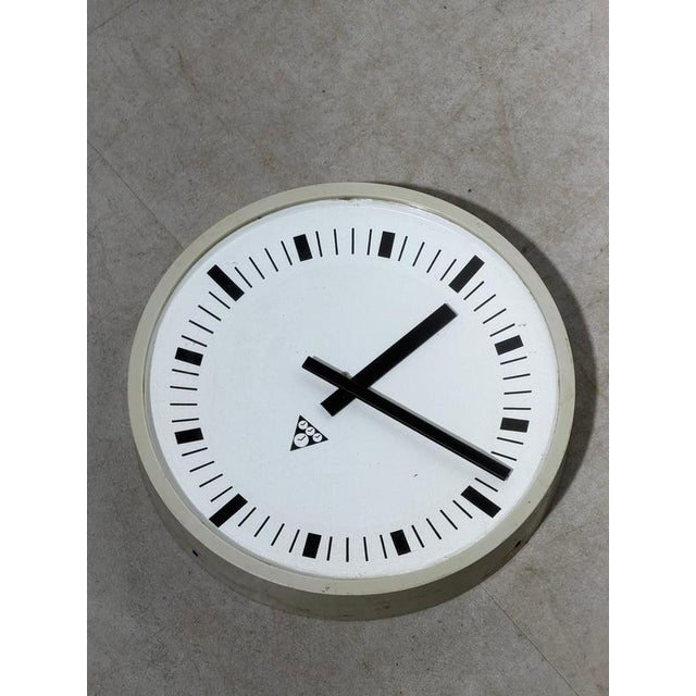 A true piece of mid-century industrial design: this authentic Pragotron wall clock, produced in former Czechoslovakia, is...