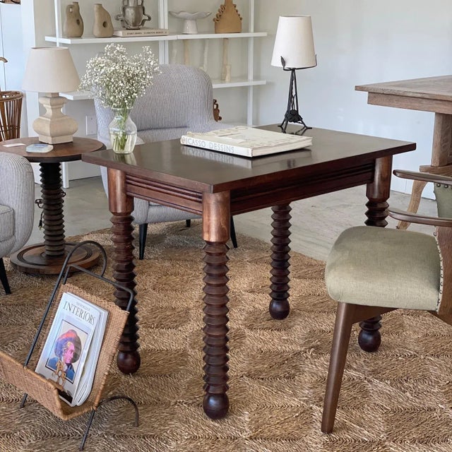 Great wood table by Charles Dudouyt, made in France, 1940's. Rectangular top with four thick carved wood legs and ball...