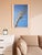 The oil painting "Domino" presents a surrealistic view of a series of dominoes ascending into the sky. These dominoes are...