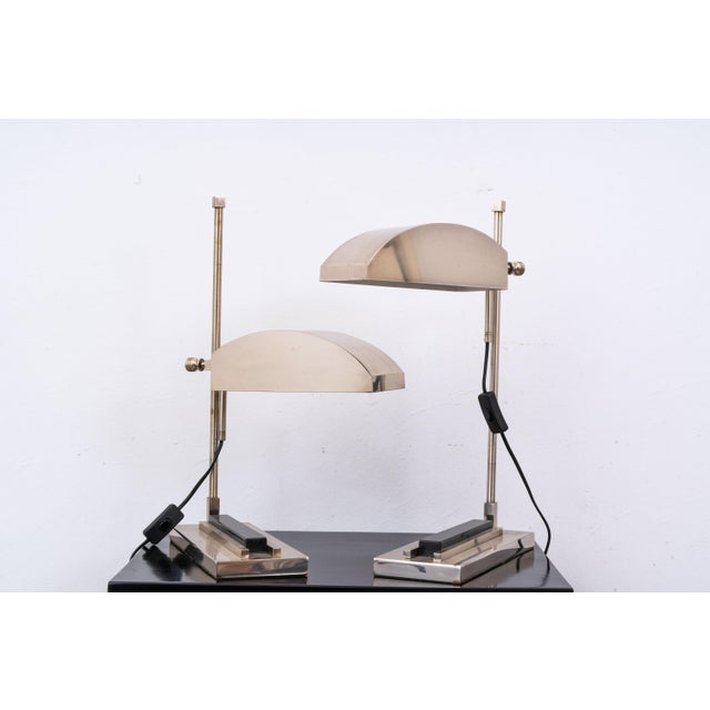 Bahaus desk lamp in nickel plated brass with a rectangular base decorated with three square-section sticks forming a...