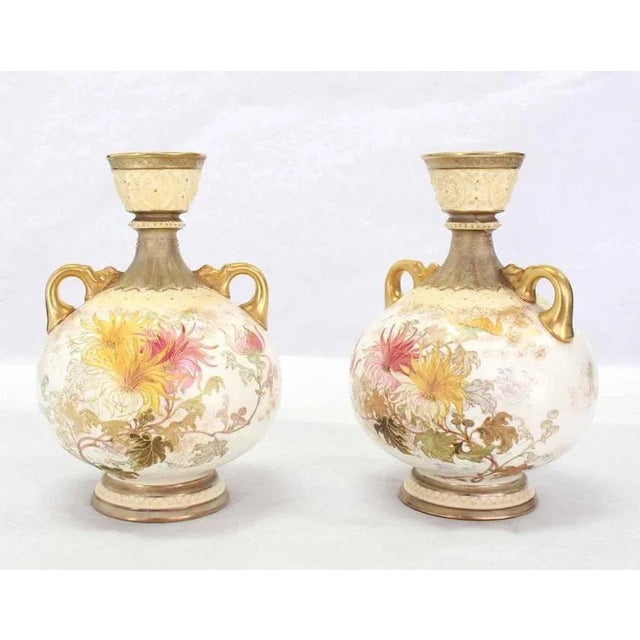 Nice floored pattern with some gold two handled pair of vases.