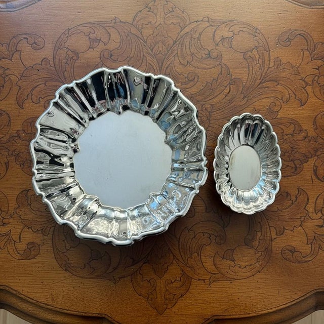 This elegant set of two silverplate bowls was produced by Reed & Barton as part of their Holiday collection, introduced in...