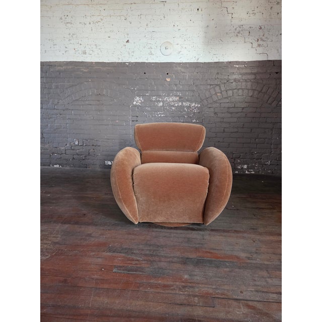 Sculptural postmodern swivel chair by Preview circa 1990. Freshly reupholstered in a golden wheat mohair velvet. No tags...