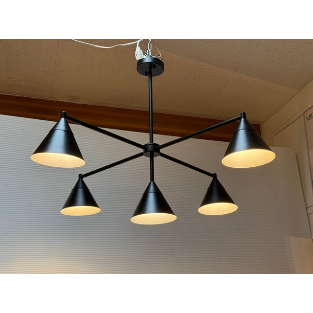 Design Plus Gallery presents a Modern Cone Chandelier from Elyccupa. The chandelier is designed in industrial vibes with...